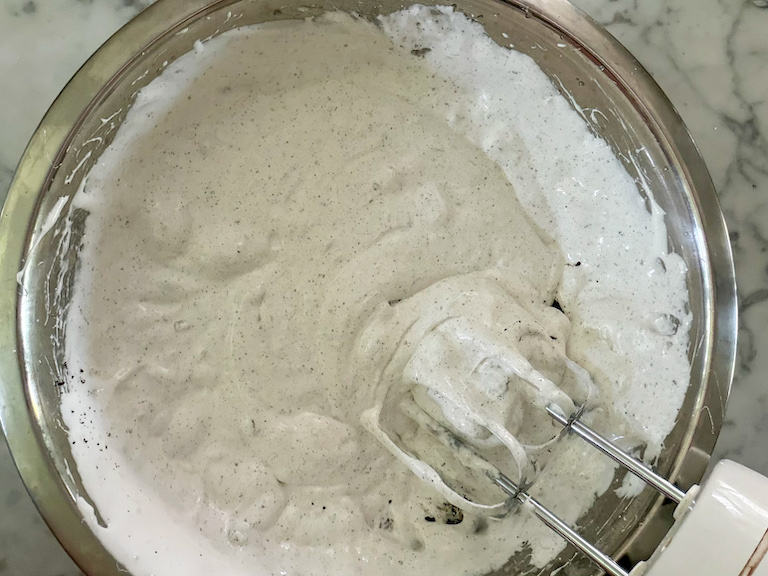 oreo marshmallow fluff in a mixing bowl with a mixer