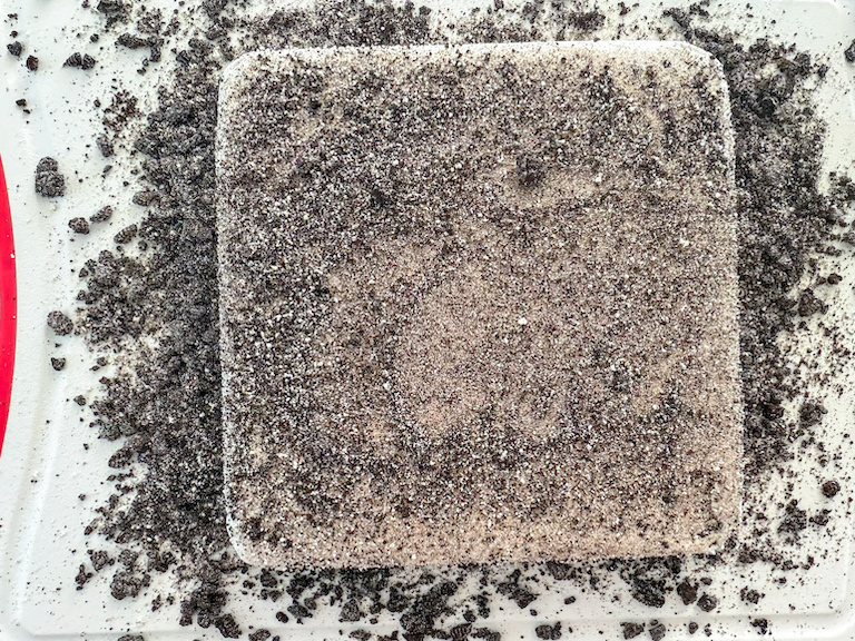 a slab of cookies and cream marshmallows with powdery oreo coating