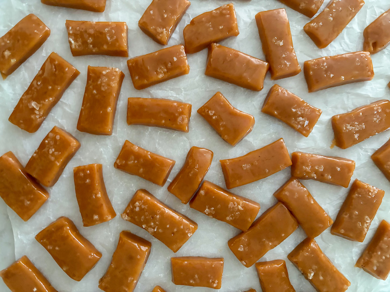 salted caramels on a sheet of parchment