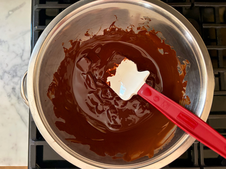 melting chocolate in a metal bowl