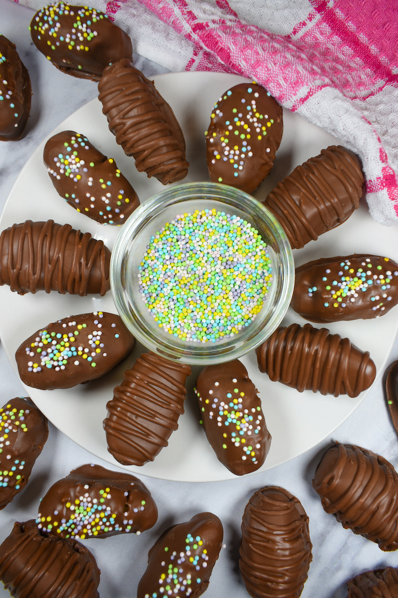 dish of nonpareils sprinkles surrounded by buttercream easter eggs