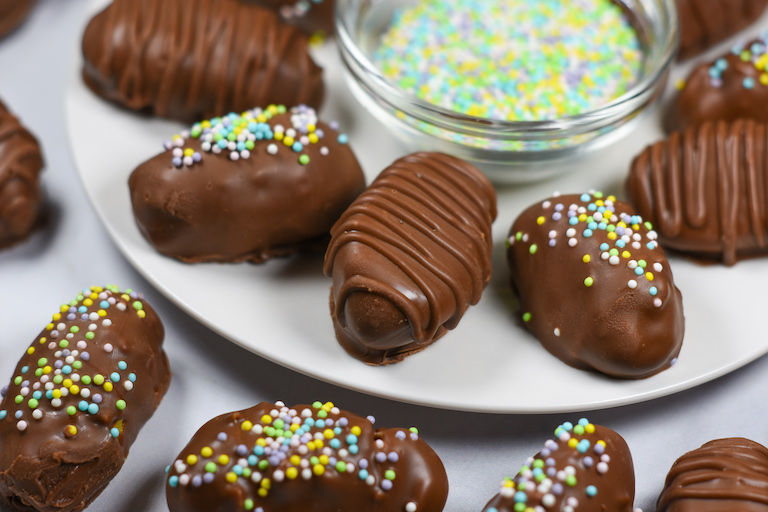 a plate of chocolate covered buttercream easter eggs