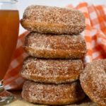 a stack of apple cider donuts