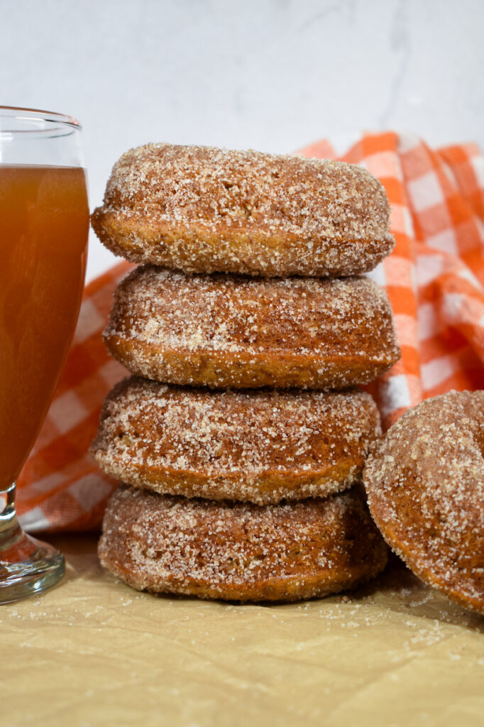 a stack of apple cider donuts