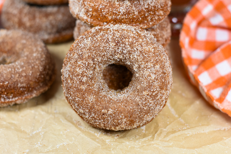 cider donuts on a sheet of parchment