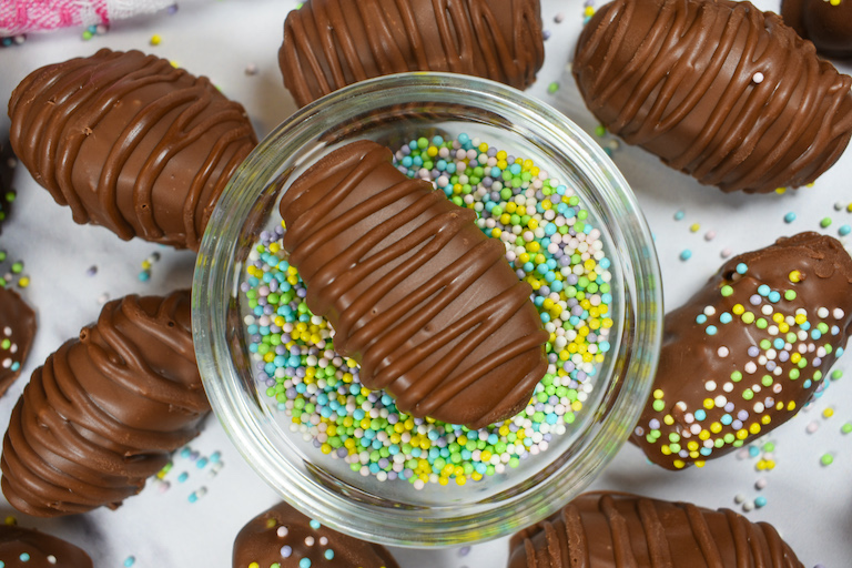 dish of nonpareils with chocolate buttercream easter egg in the middle
