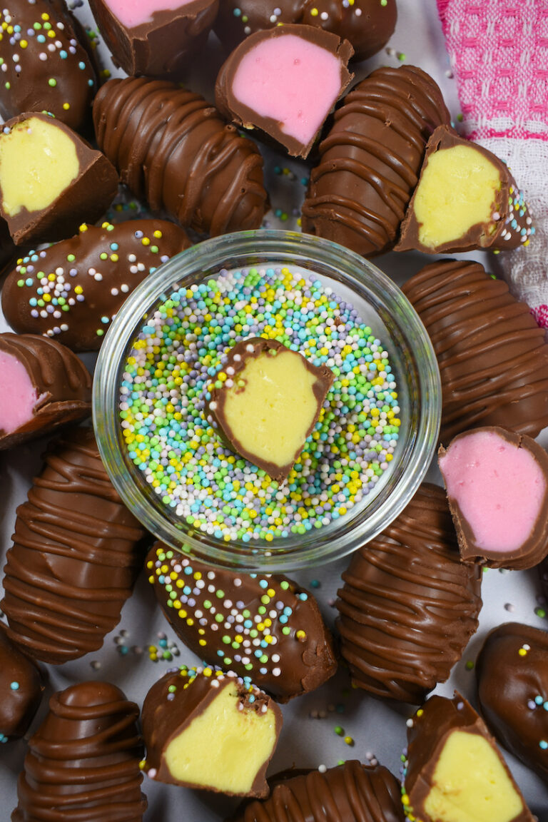 a dish of nonpareils surrounded by buttercream easter eggs
