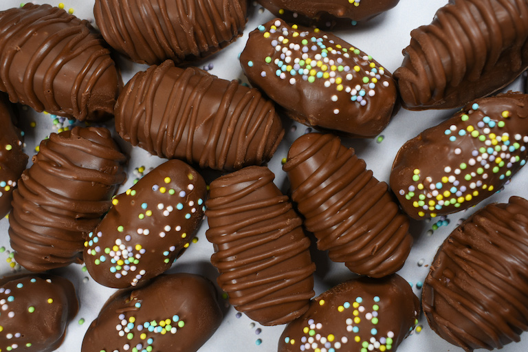 buttercream easter eggs on a white surface