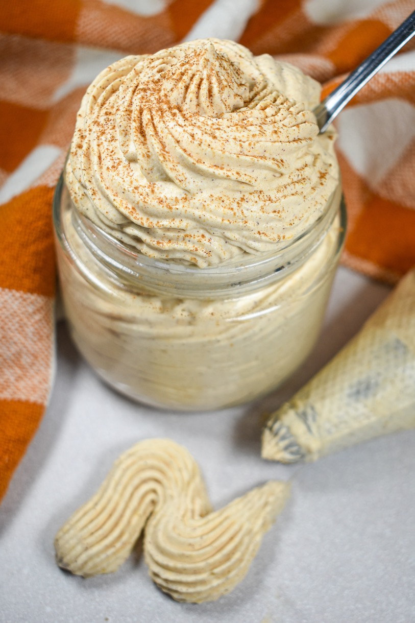 pumpkin whipped cream in a jar and piping bag