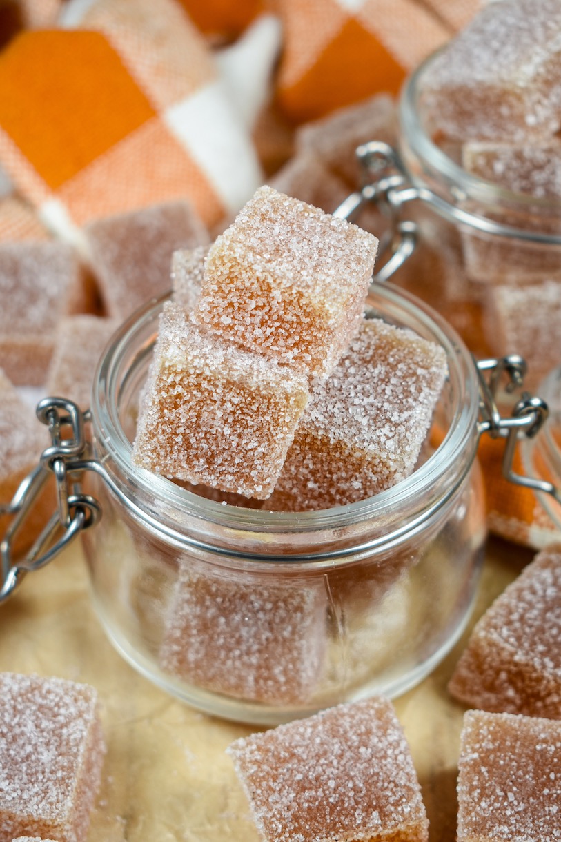 a small jar of sugar-coated apple candies