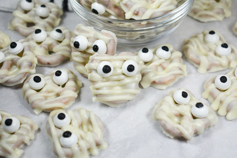 white chocolate mummy pretzels with spooky candy eyeballs