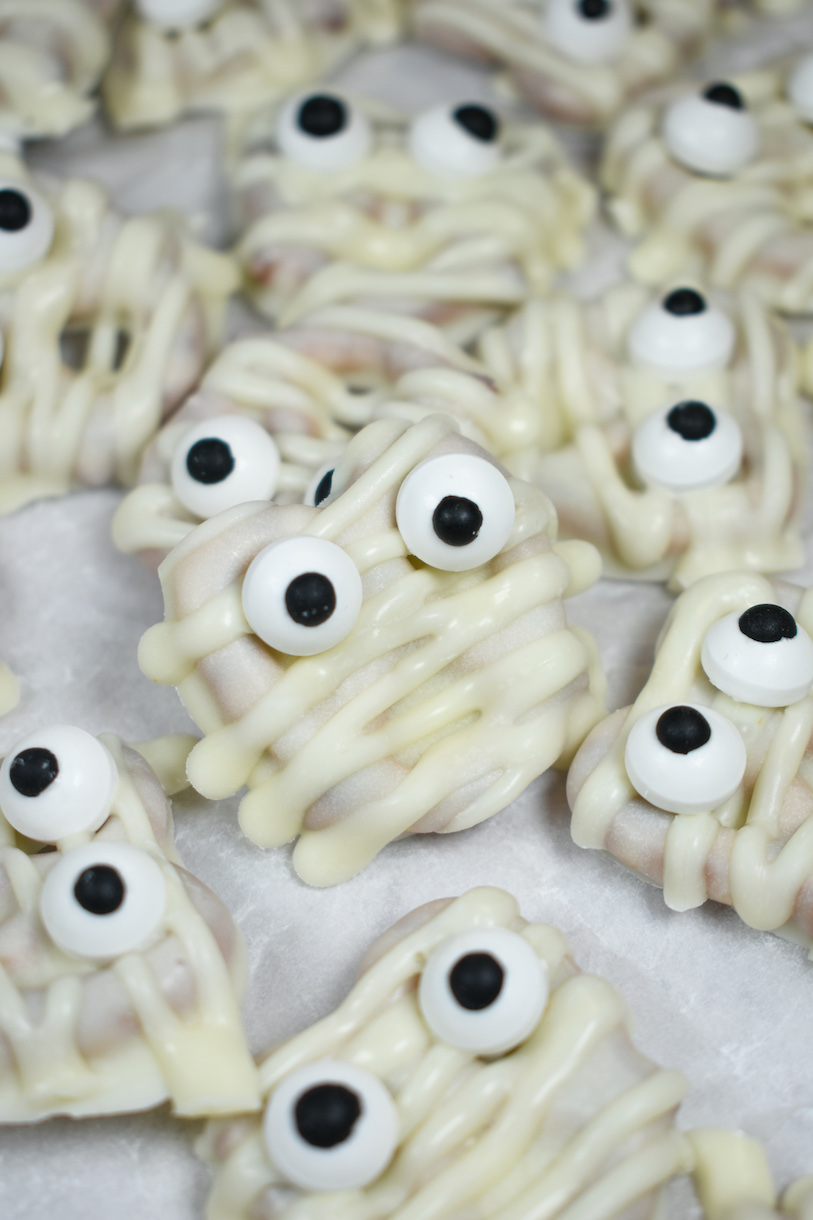 mummy pretzels on a white surface