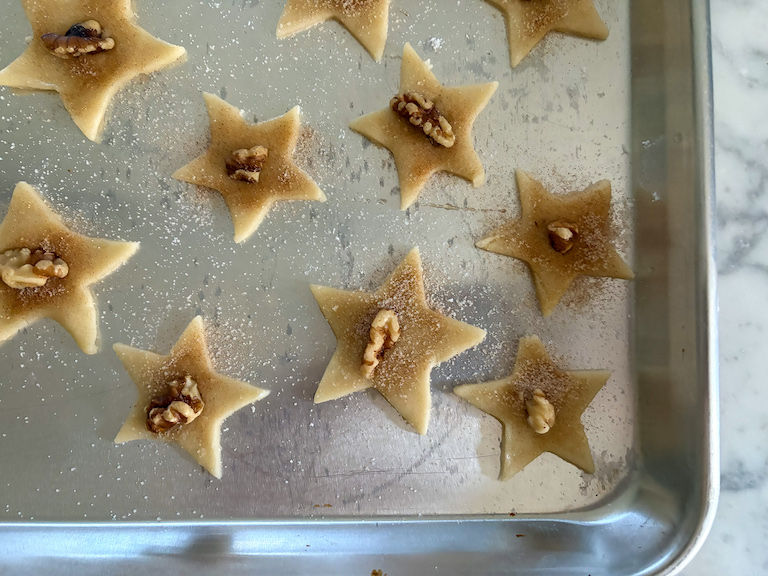 sand tart cookies decorated with nuts and cinnamon sugar