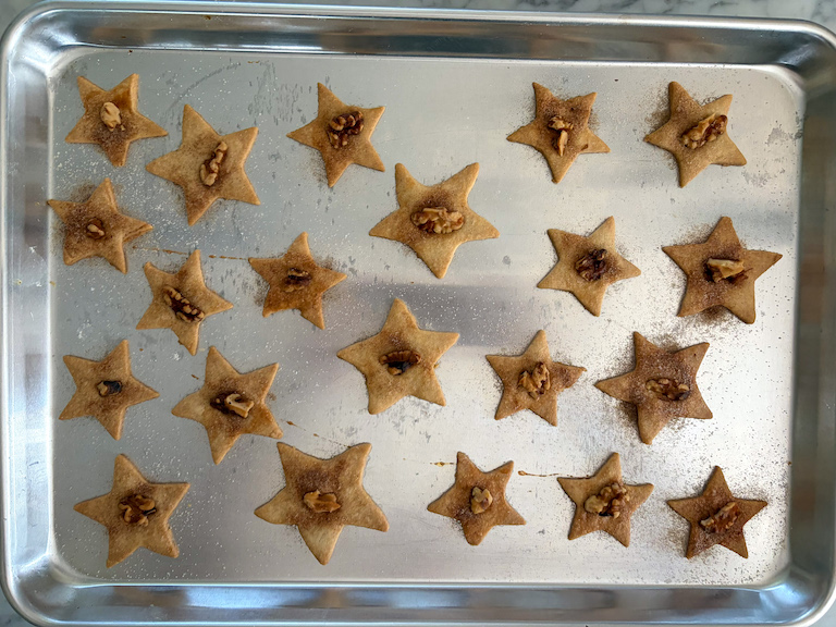 star shaped sand tart cookies on a metal tray