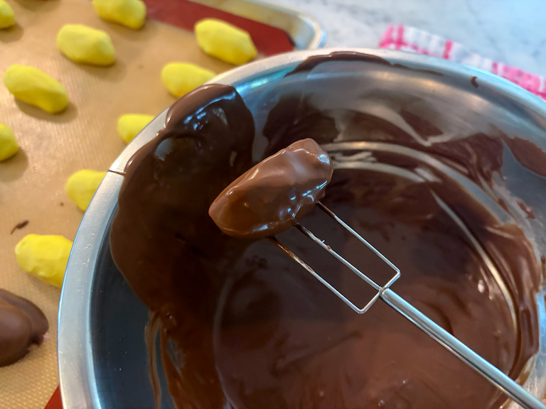 enrobing fork with chocolate dipped egg