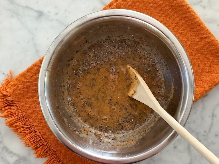 stirring pumpkin spice chia seed pudding ingredients in a bowl