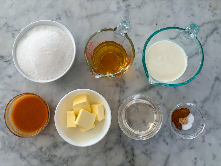 Pumpkin caramels recipe ingredients on a marble surface