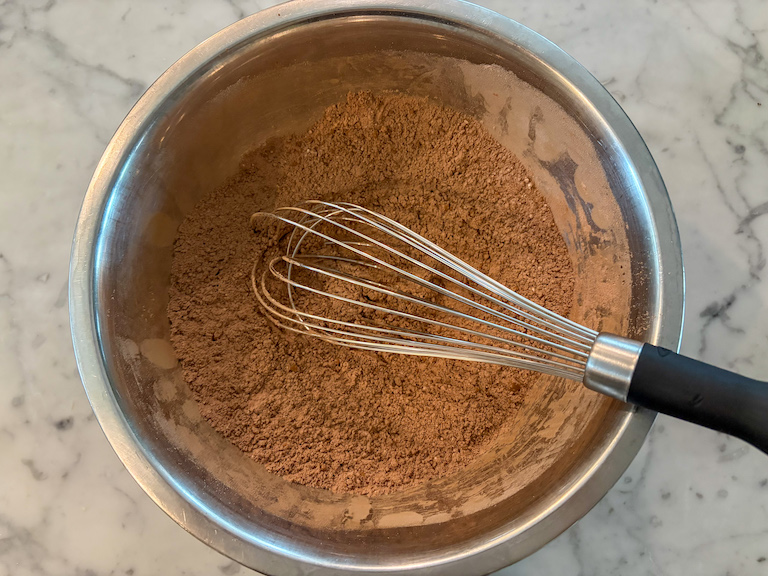 dry ingredients in a bowl with a whisk