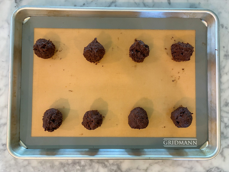 balls of chocolate cookie dough on a tray