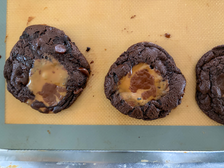 milk dud cookies on a tray after baking