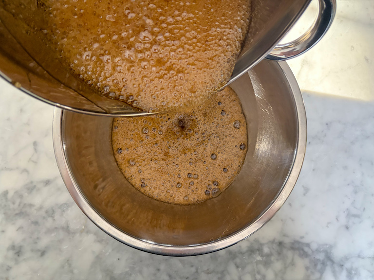pouring hot coffee syrup over gelatin