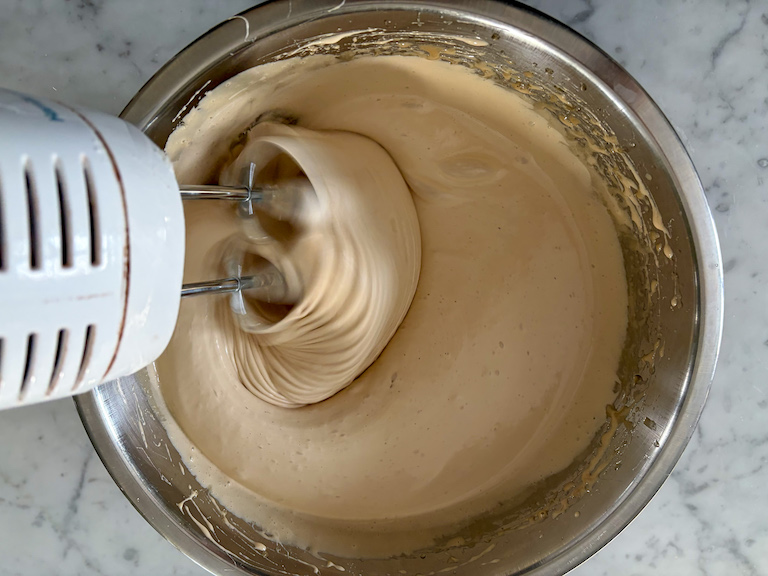 mixing marshmallow fluff with a hand mixer