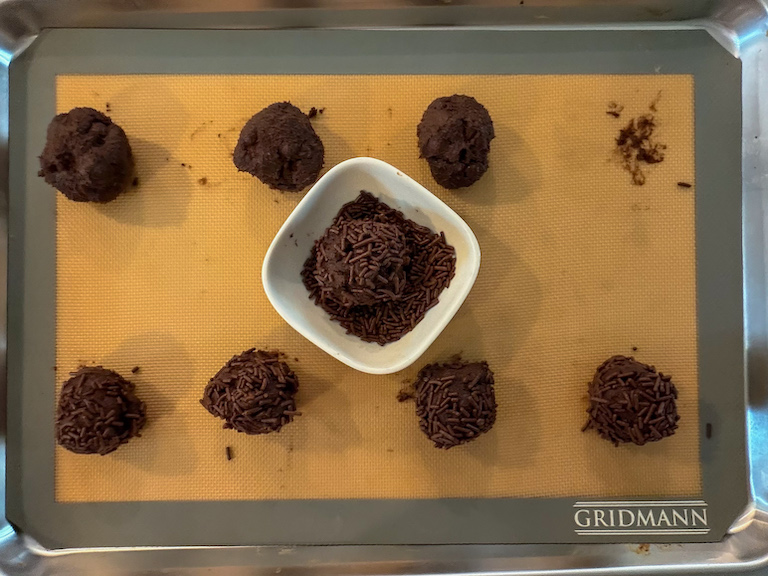 balls of cookie dough and dish of sprinkles