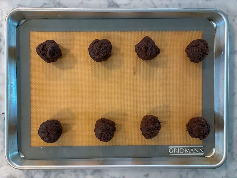 chocolate cookie dough balls on a tray