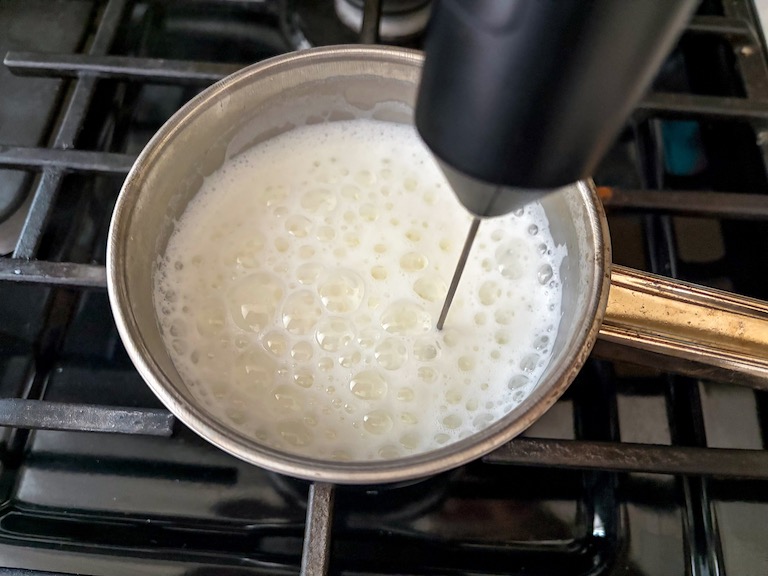 frothing milk with a frother