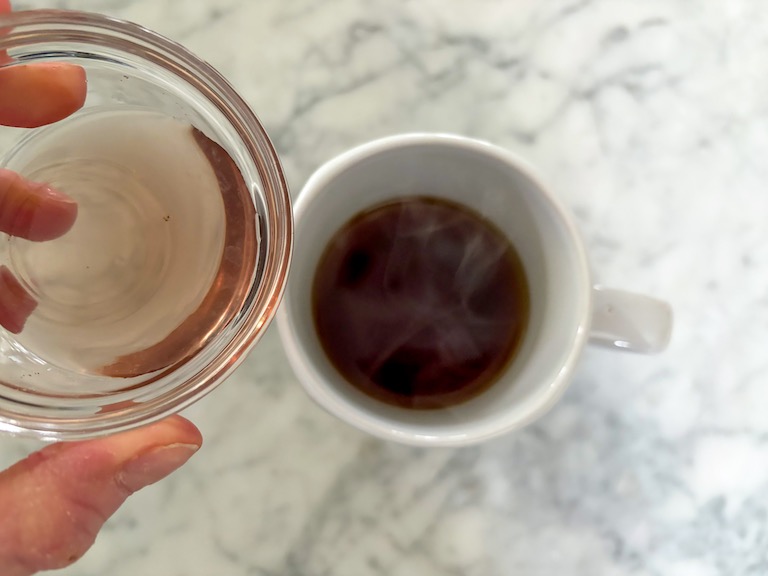 adding lavender syrup to a mug of tea