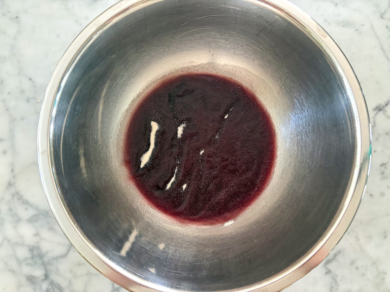 red wine and gelatin in a metal bowl