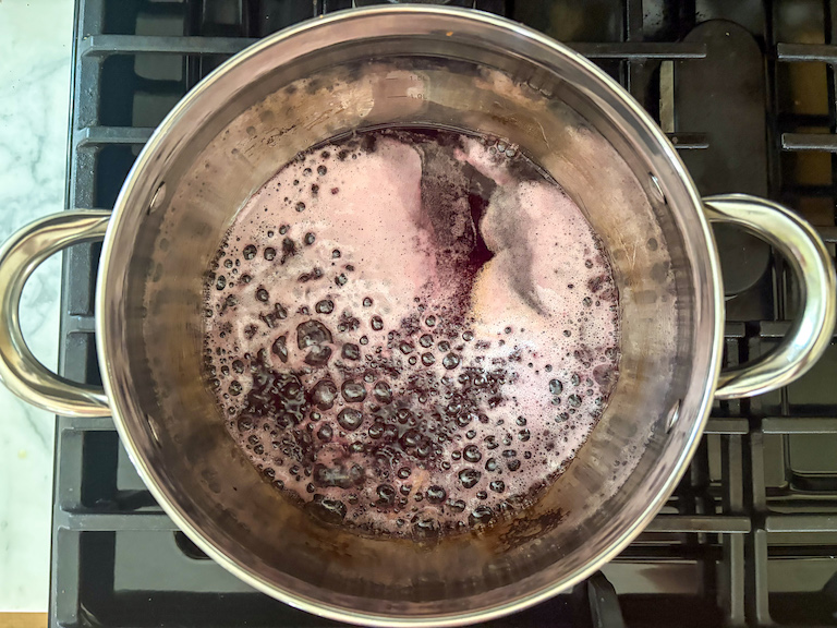 red wine and sugar in a stock pot on the stovetop