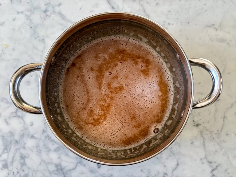 apple cider in a stock pot