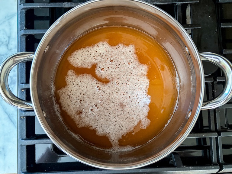 cider, sugar, and gelatin in a pan on the stovetop