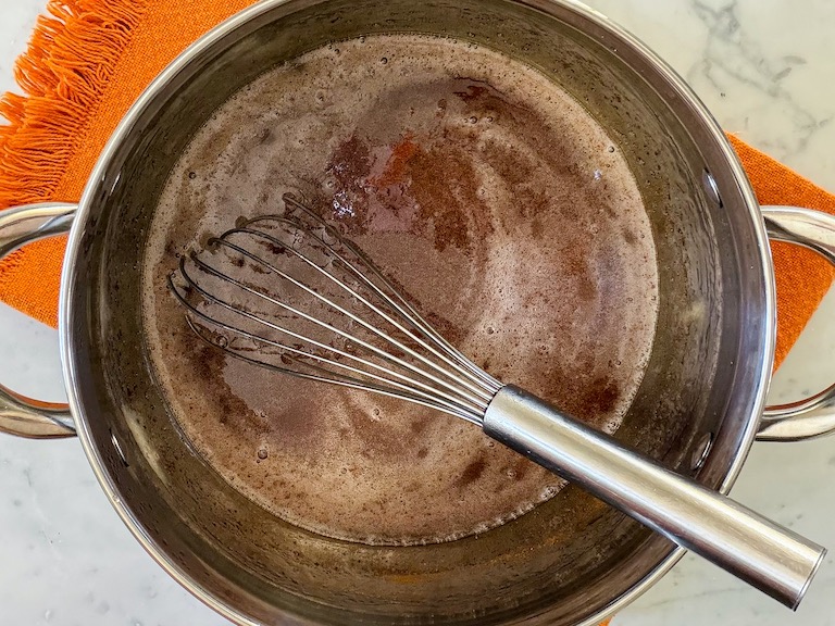 cider and gelatin in a stock pot