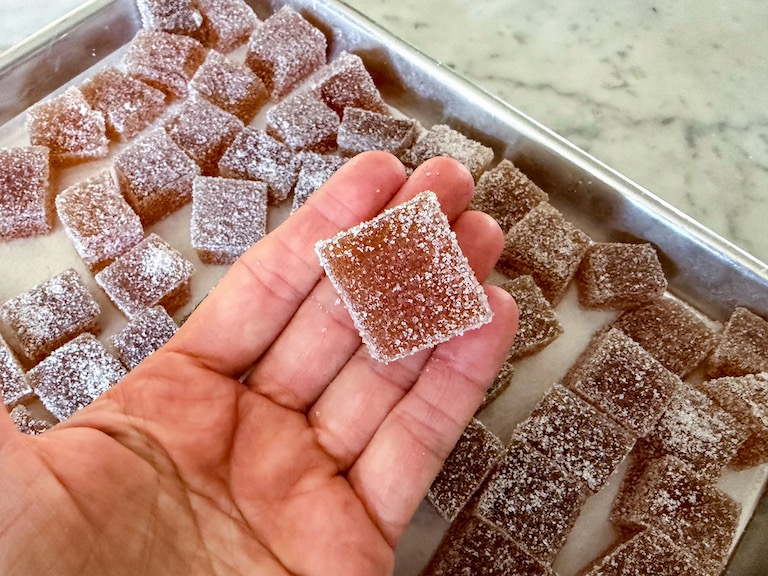 hand holding an apple cider gummy candy