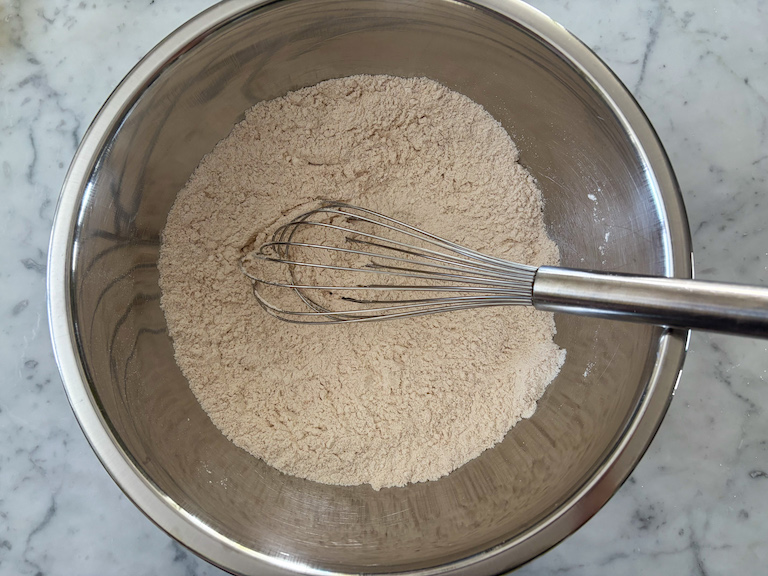 dry ingredients in a bowl with a whisk