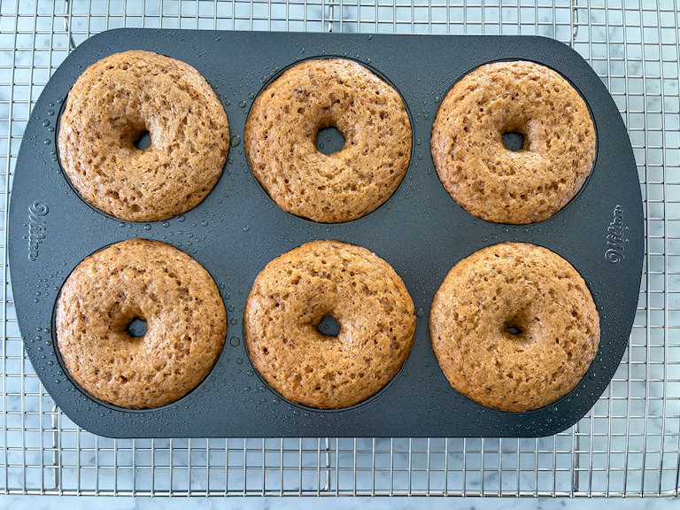 cider donuts in a pan after baking