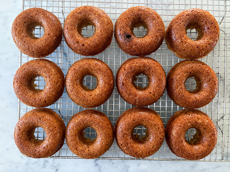 donuts cooling on a wire rack