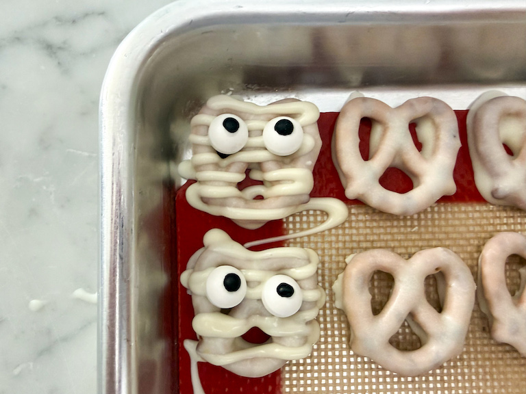 mummy pretzels on a small tray
