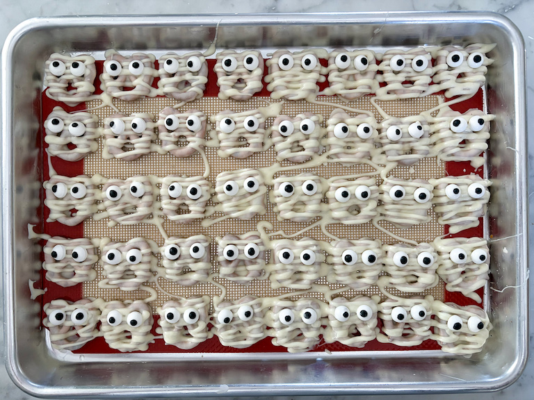 mummy pretzels on a small tray