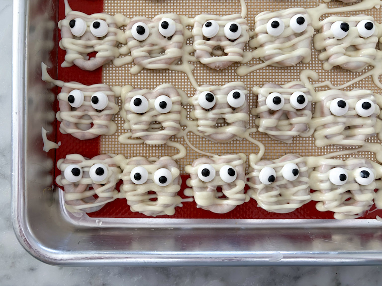 mummy pretzels on a small tray