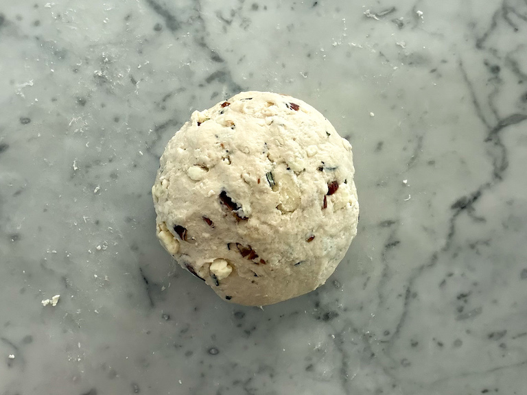 ball of blue cheese and date bread dough