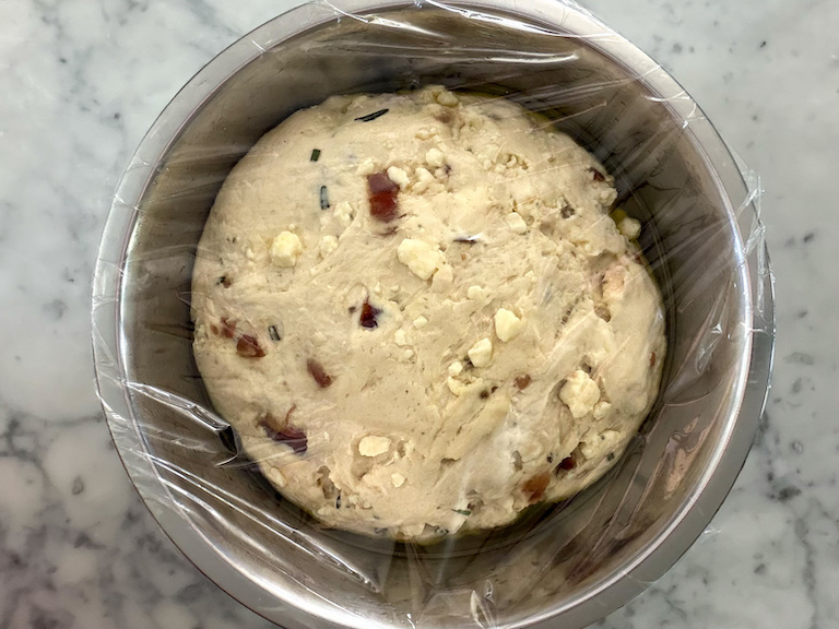 bread dough rising in a bowl