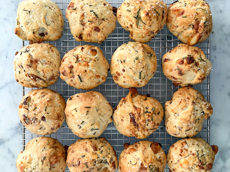 dinner rolls cooling on a wire rack