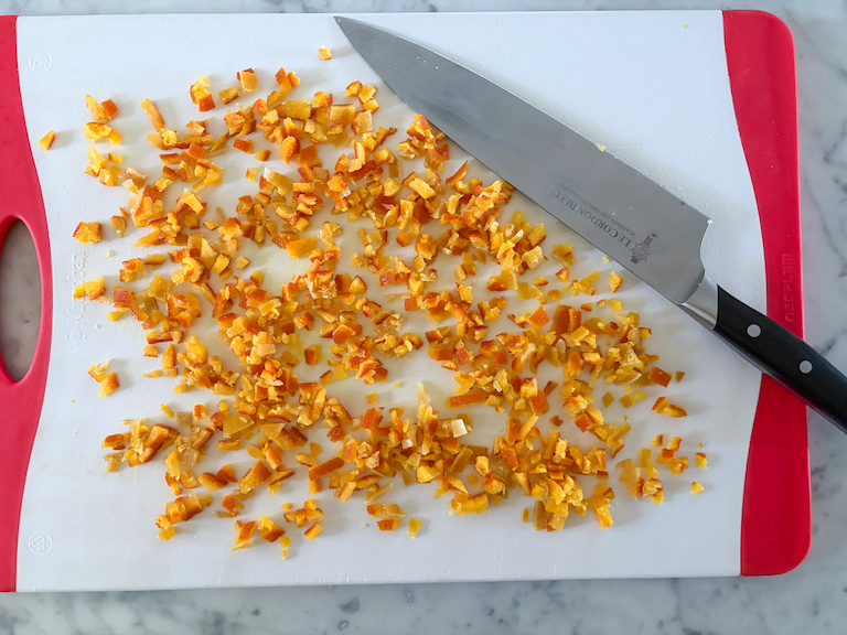 knife slicing candied peel into small pieces